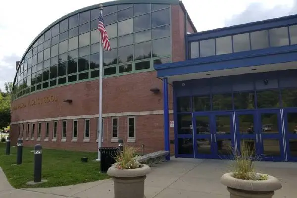 A building with a flag on the front of it.