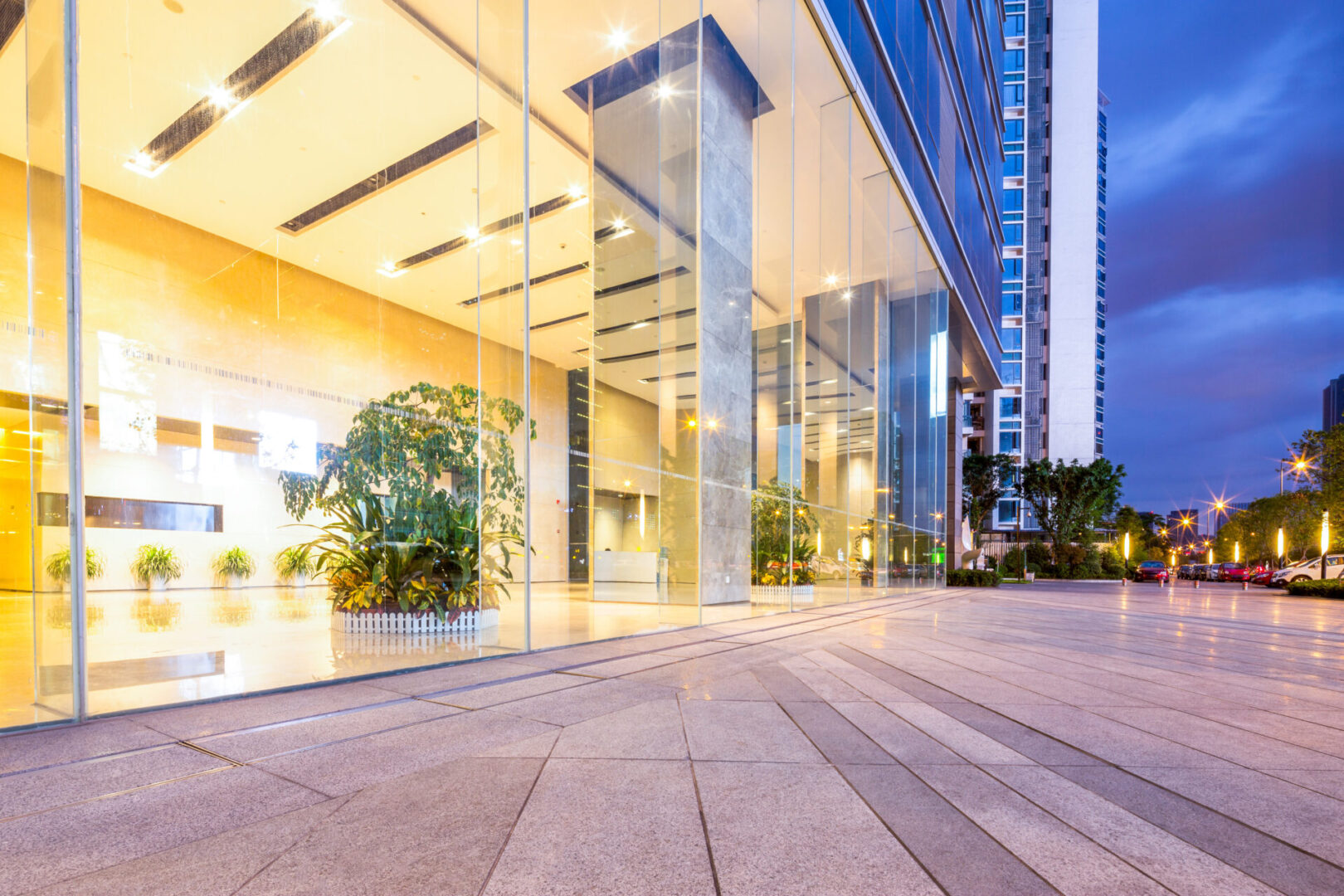 A building with glass windows and concrete floors.