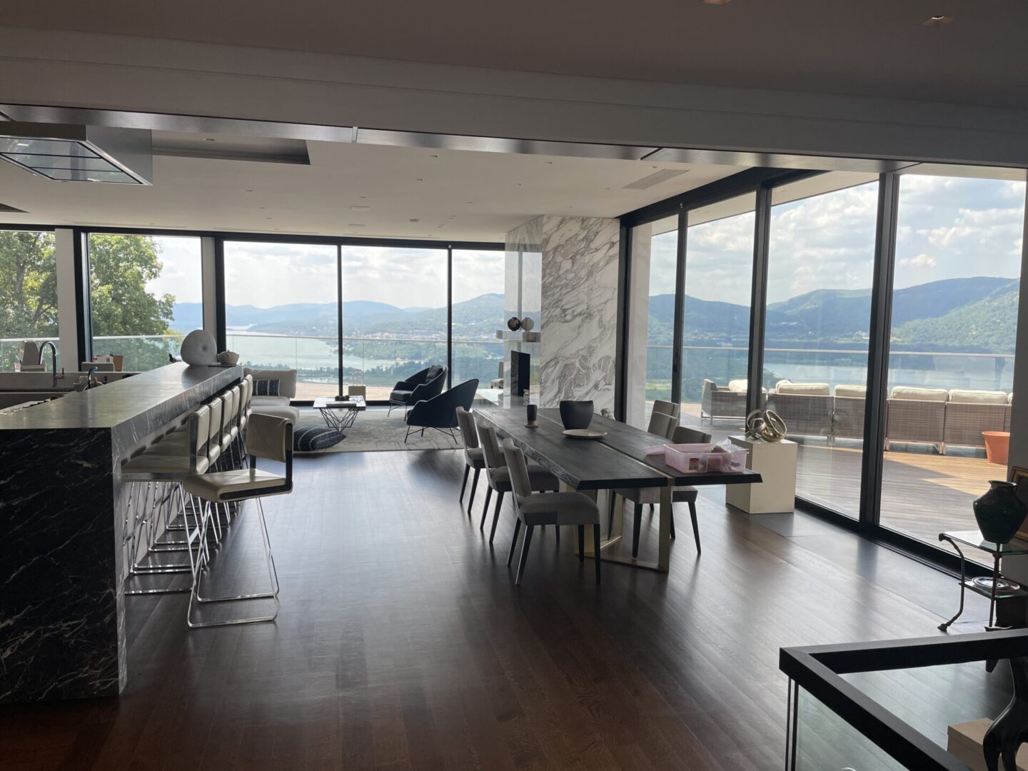 A large open living room with a view of the mountains.